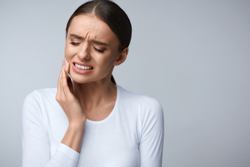 Women experiencing tooth pain